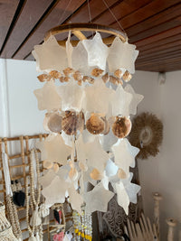 Clear and natural shell mobile hanging. Stars